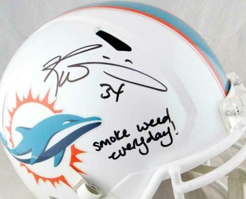 Ricky Williams assinou os golfinhos f/s capacete de velocidade com fumaça de ervas daninhas - jsa w auth *preto - capacetes da NFL autografados